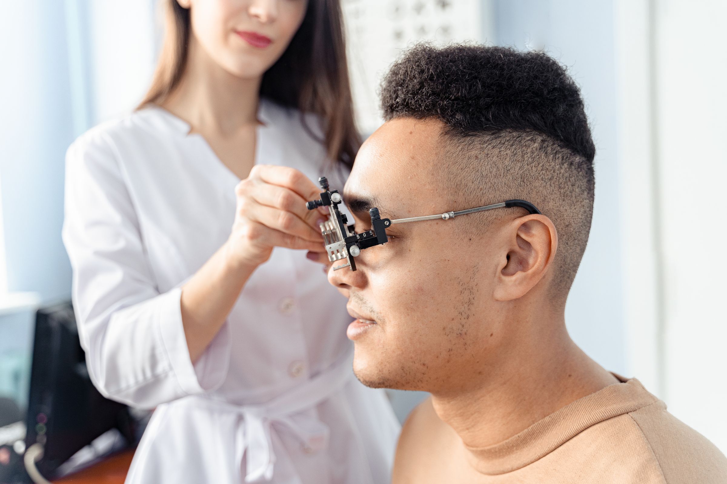 Young adult being assessed for corneal treatment