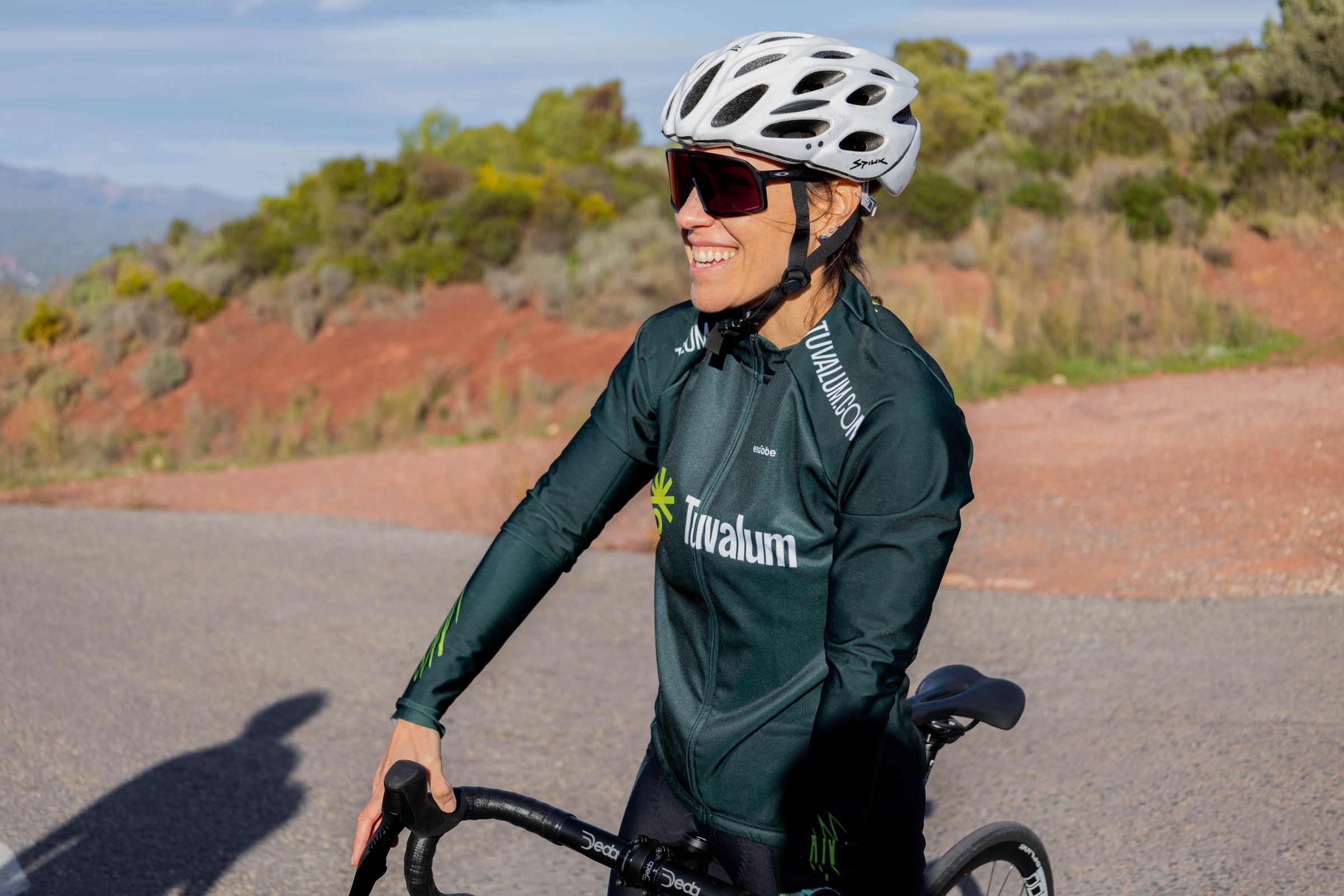 Cyclist wearing sunglasses in bright sunlight